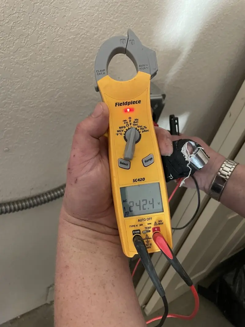Voltage testing with clamp meter during Whole House Surge Protector in Port Angeles